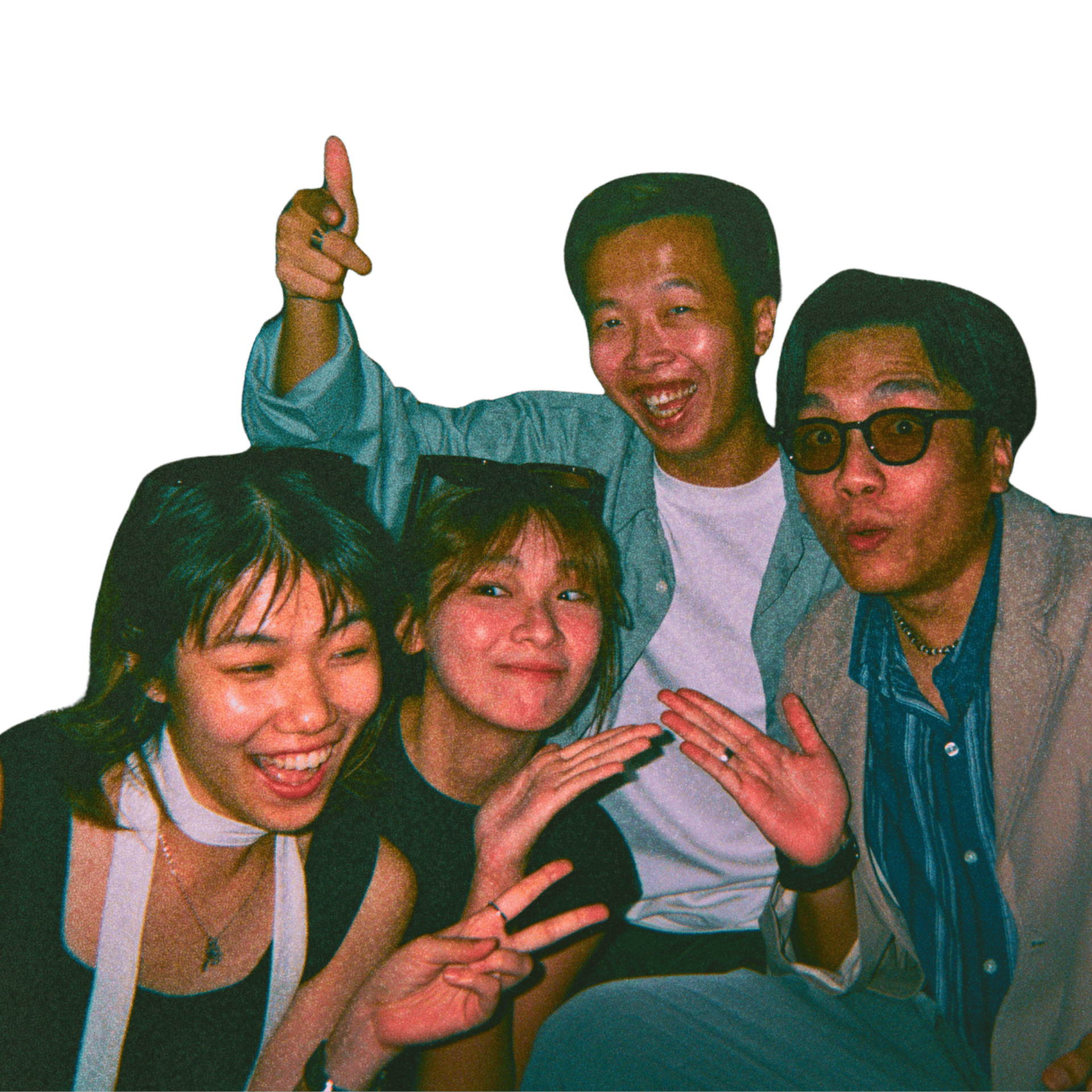 Group of four teenage friends smiling and posing for a lively photo, making peace signs and playful gestures.