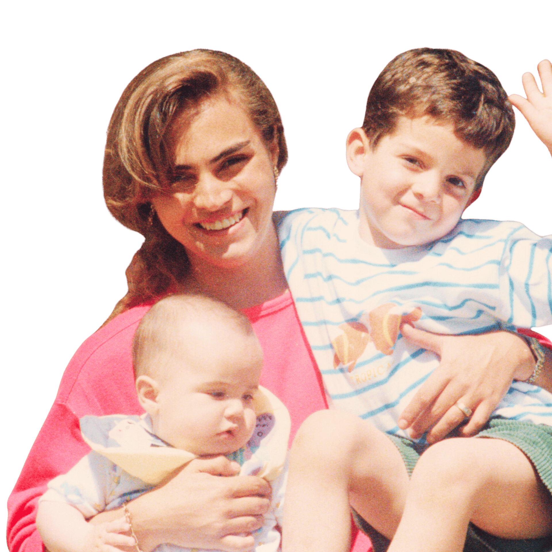 Father holding a red gift box while his son hugs and whispers to him, with a younger child sitting nearby.