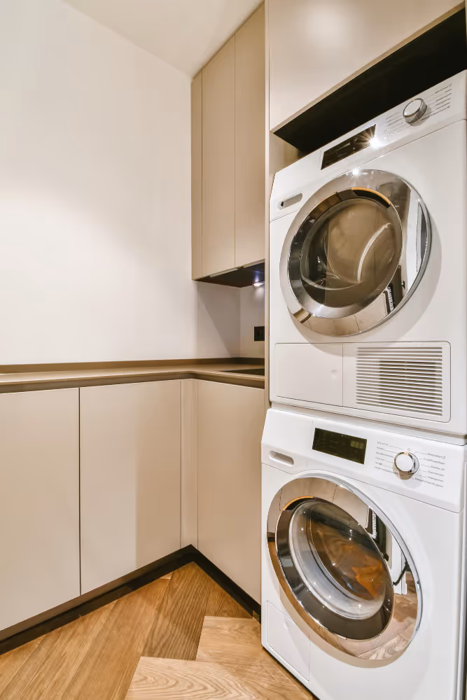 Stacked washer and dryer appliances in a modern laundry room