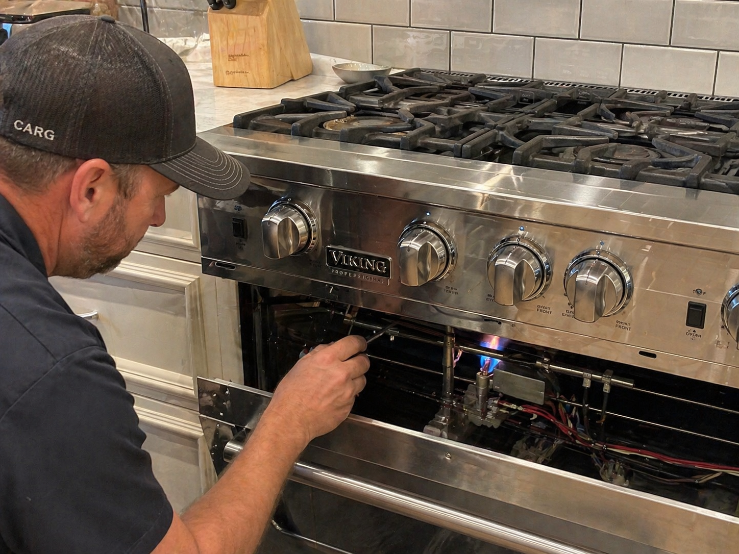 Technician repairing Viking gas range igniter in Moreno Valley CA