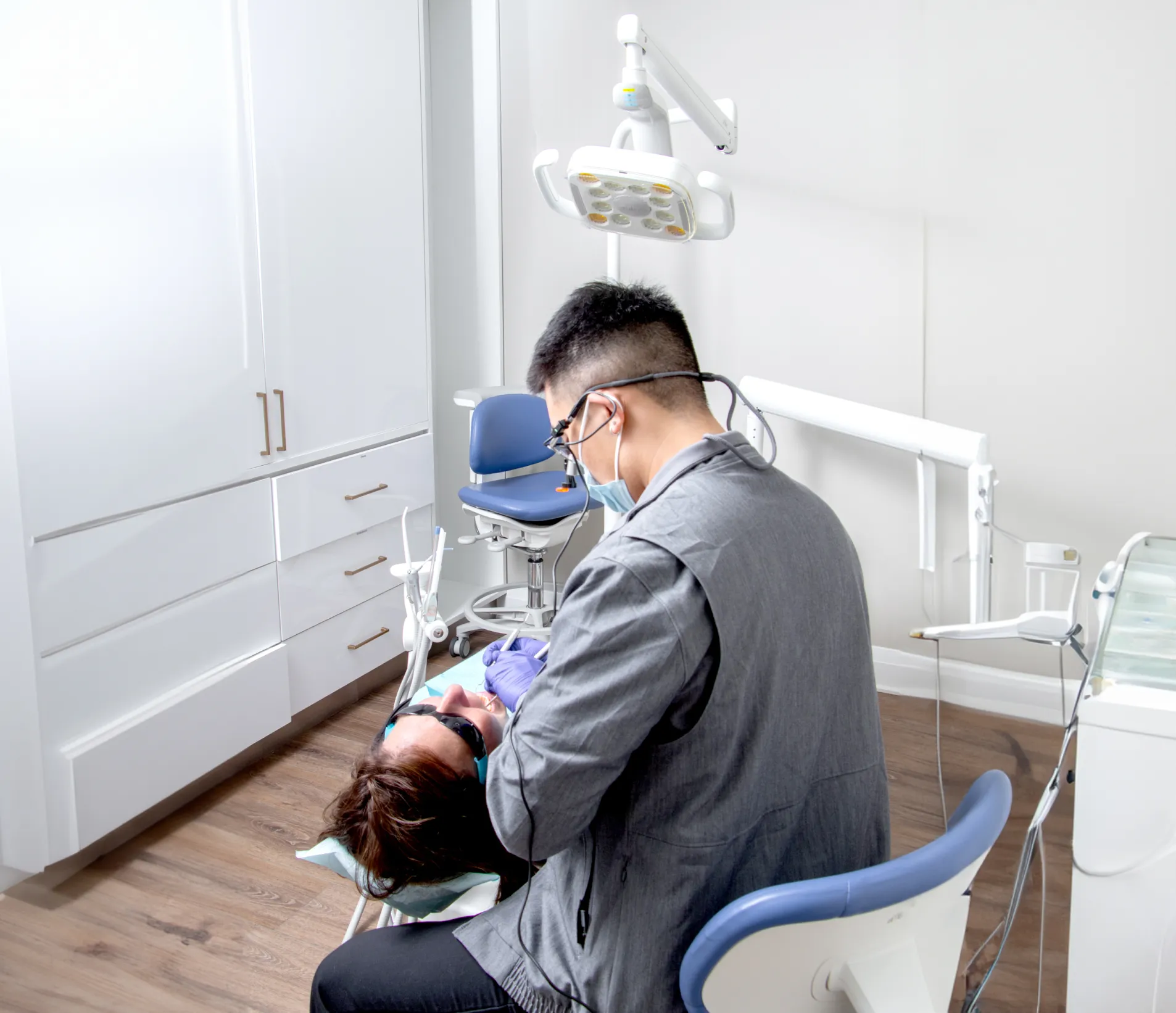 Dr. Yoon performing a dental checkup on a patient