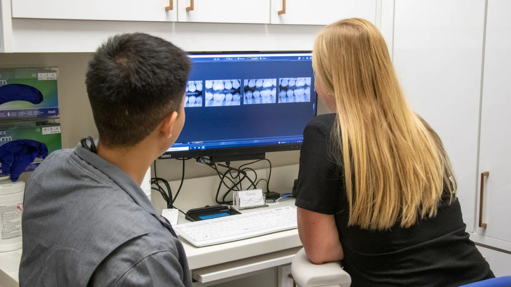 Lansdowne Place Dental Team looking at x-ray