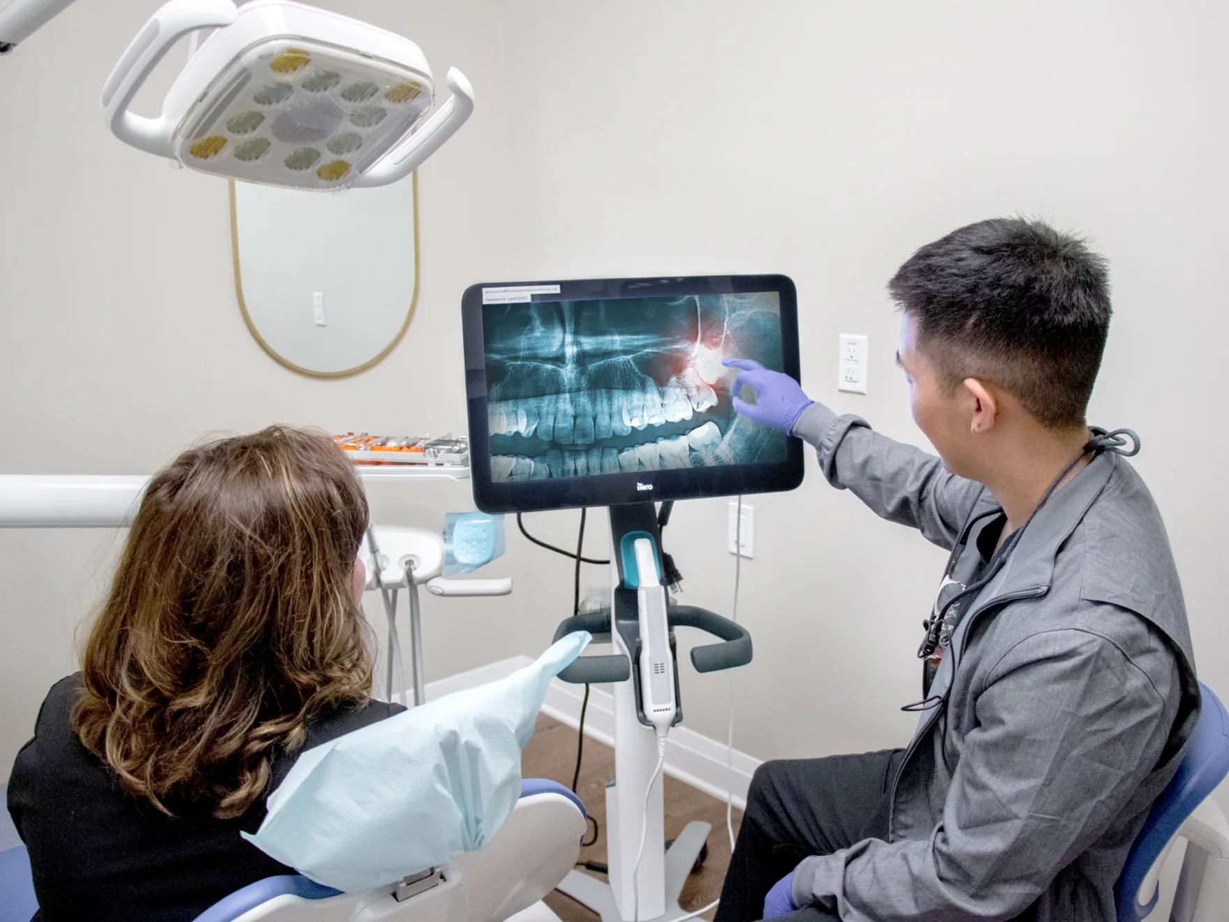 doctor showing an x-ray image to patient