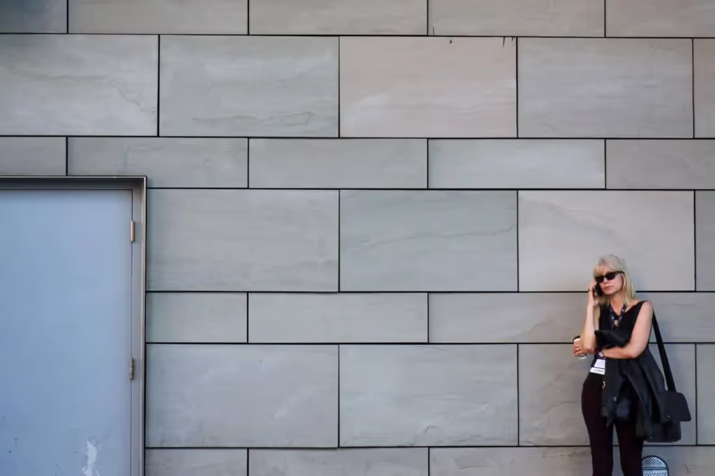 Woman on the phone negotiating for a hotel rate