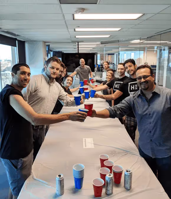 Team members at Engine play "caffeine pong"
