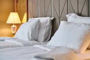 Two twin beds in a hotel room