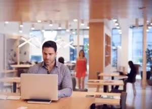 Man typing in co-working space