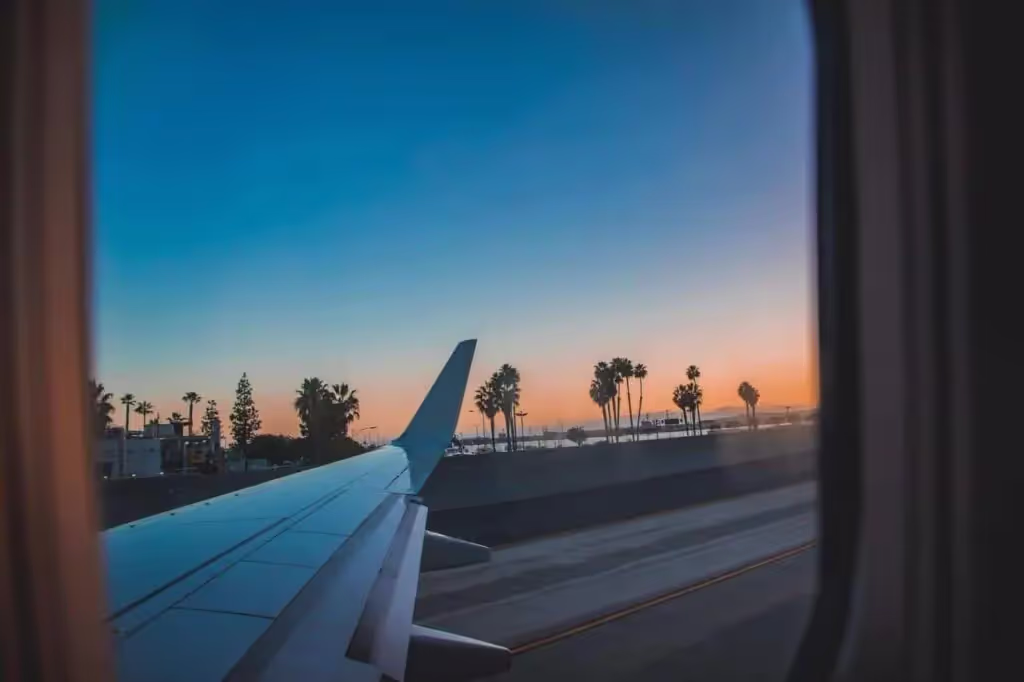 Plane wing seen outside plane window