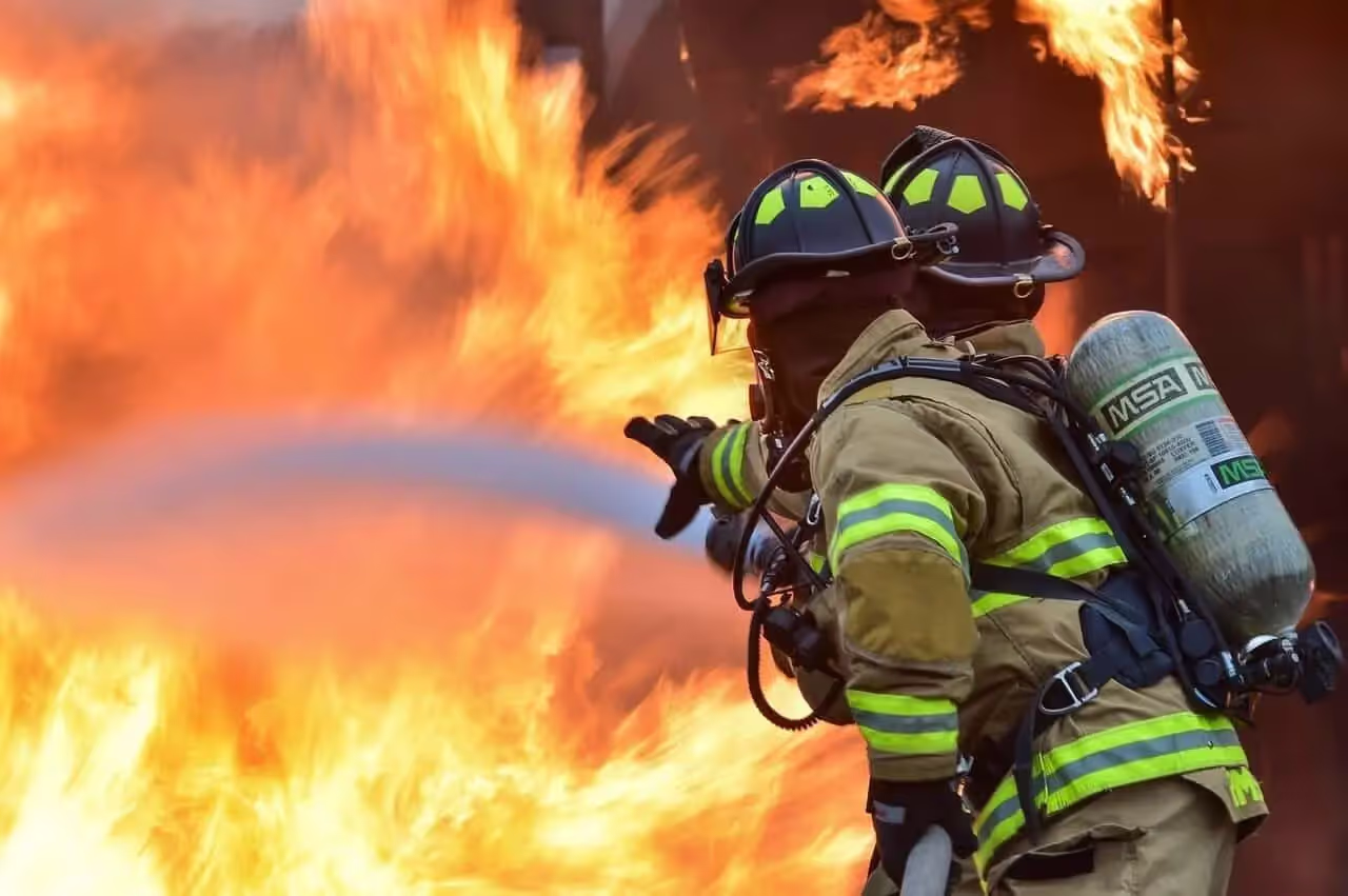 Firefighters extinguishing fire