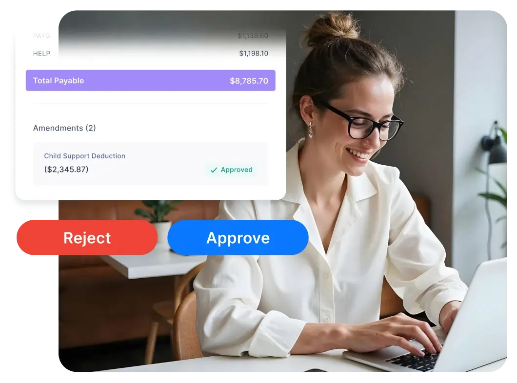 Smiling woman with glasses typing on a laptop with a payroll approval interface showing options to reject or approve.