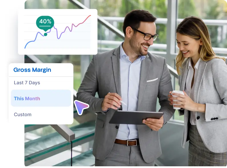 Two professionals in gray business attire smiling and reviewing data on a tablet with a graphical overlay showing gross margin options and a 40% data point.