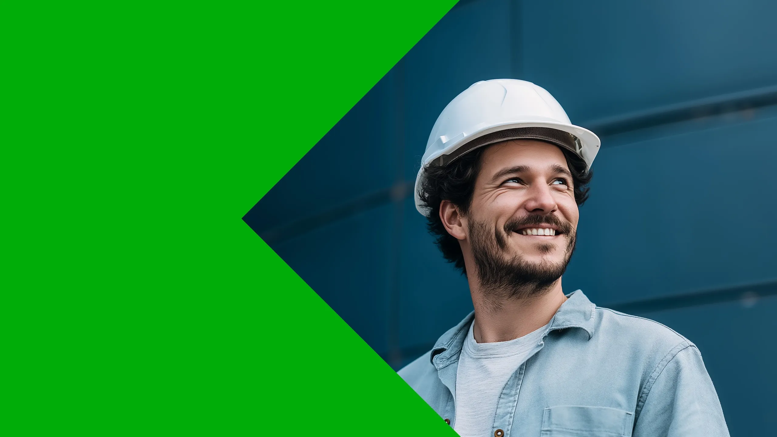 Smiling man wearing a white safety helmet and blue shirt looking to the side with a dark blue background and green geometric shape on the left.