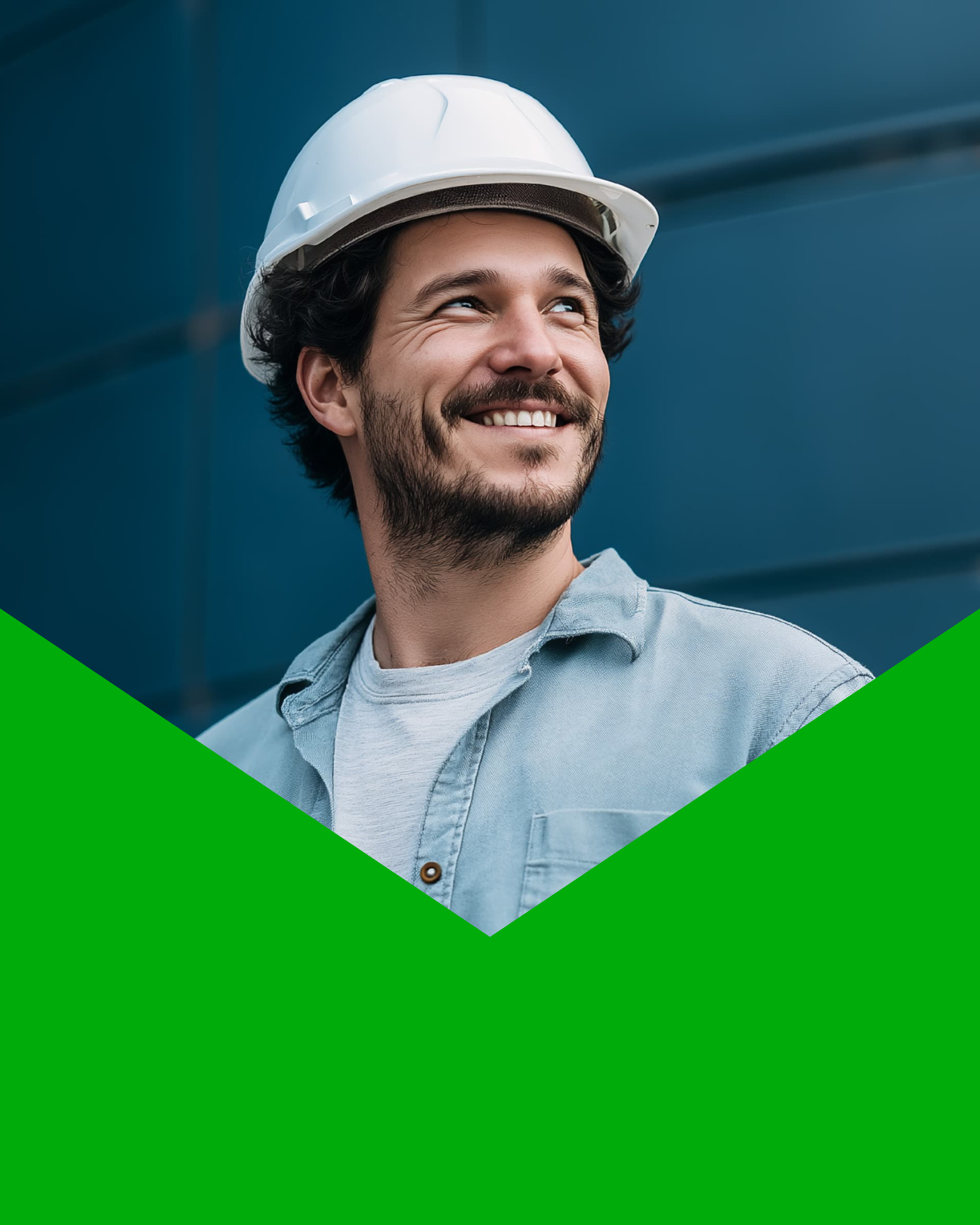 Smiling construction worker wearing a white hard hat and denim shirt looking upward.