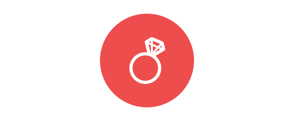 White diamond engagement ring icon on a red circular background.