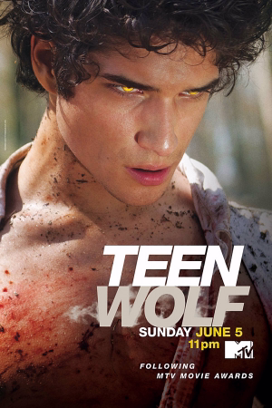 Close-up of a young man with glowing yellow eyes and a blood-splattered chest, promoting Teen Wolf airing Sunday June 5 at 11pm on MTV.