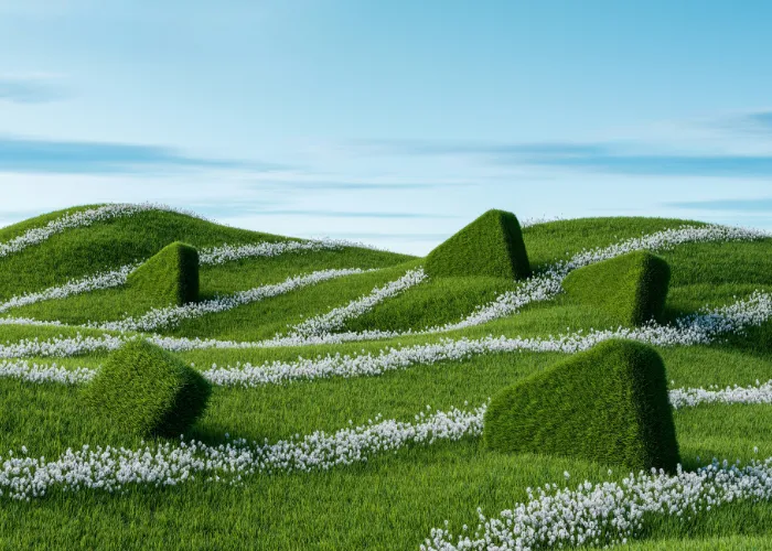 Sculptural green hills with white flower streams under blue sky