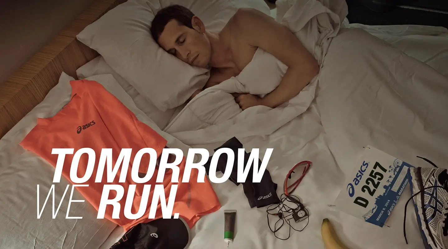 Sunrise over a lush green farm field with rows of plants and distant mountains, overlaid with Wild Daisy Farms logo featuring a stylized white flower with an orange center and the text 'Rooted in North Carolina'.