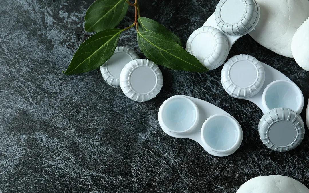 Contact lens cases and cleaning solution for proper lens hygiene and storage
