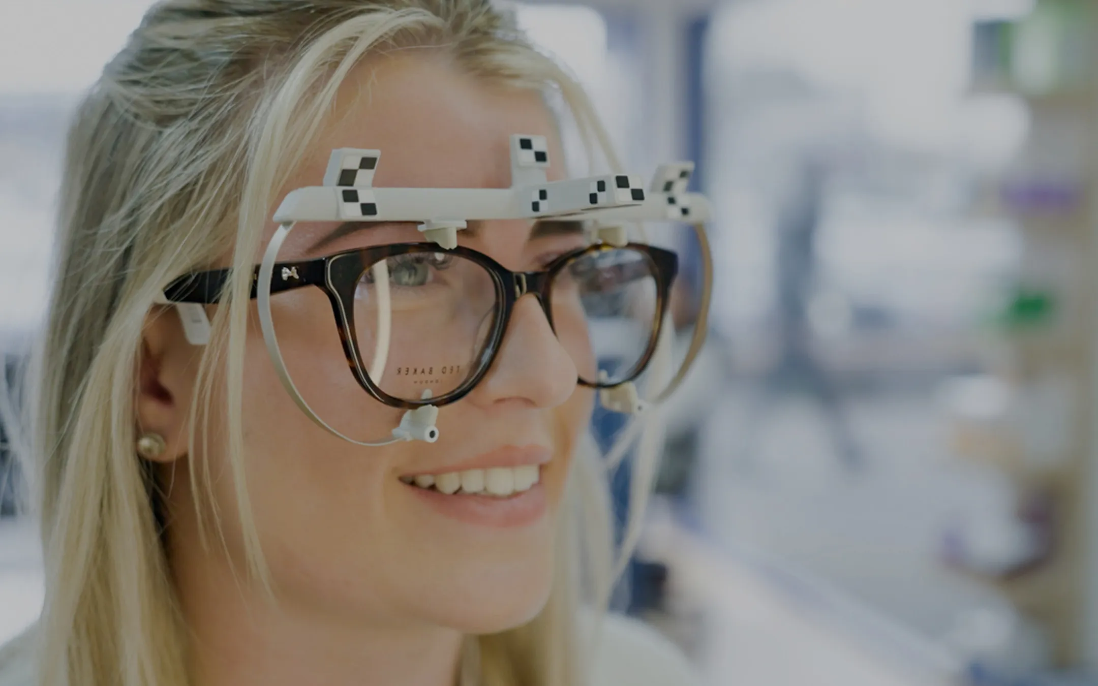 Patient wearing trial frames during an eye test at a professional opticians practice