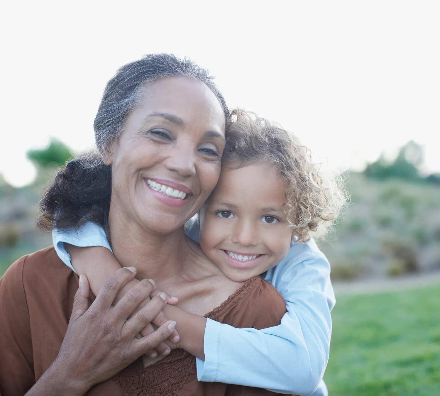 Grandmother and grandchild enjoying improved hearing after professional ear wax removal service