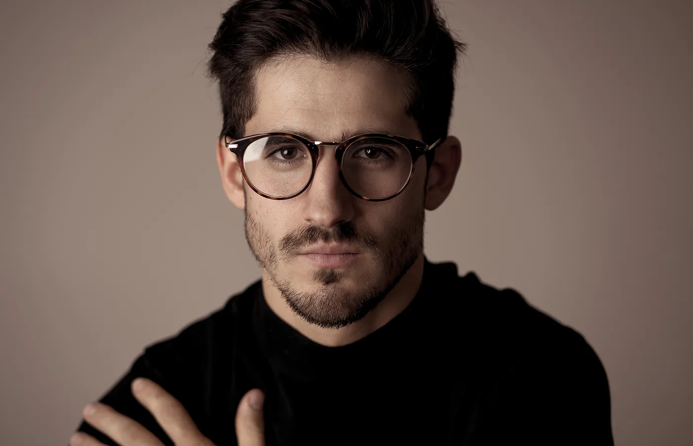 Man wearing stylish round tortoiseshell prescription eyeglasses from independent opticians
