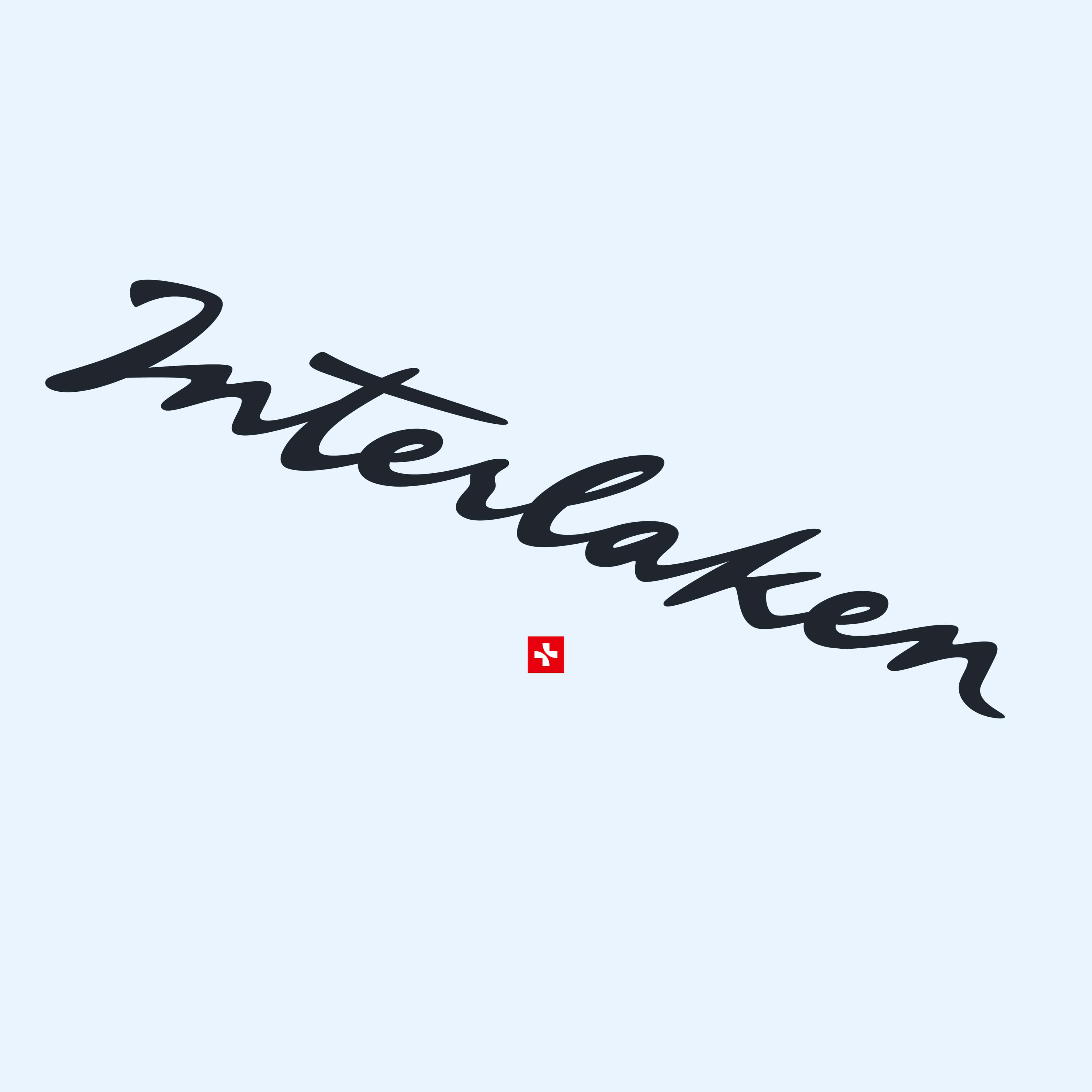 Das Wort „Interlaken“ in schwarzer, künstlerischer Handschrift auf hellblauem Hintergrund.