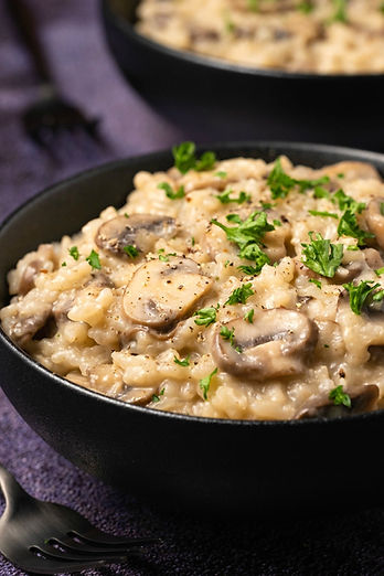 Mushroom Risotto served with fresh herbs sprinkled on top