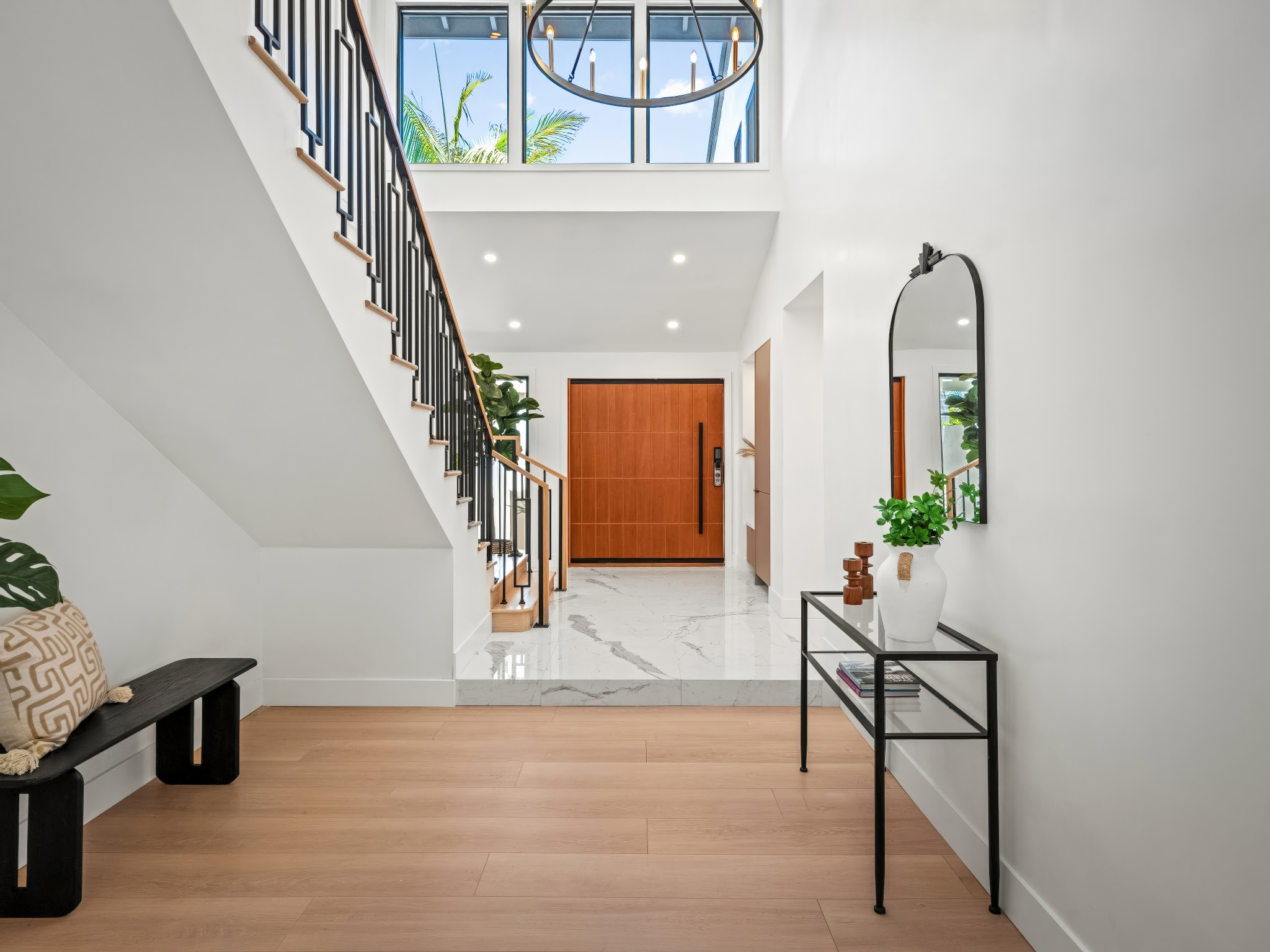 Whitewater Residence courtyard terrace with crisp white volumes and relaxed indoor-outdoor flow.