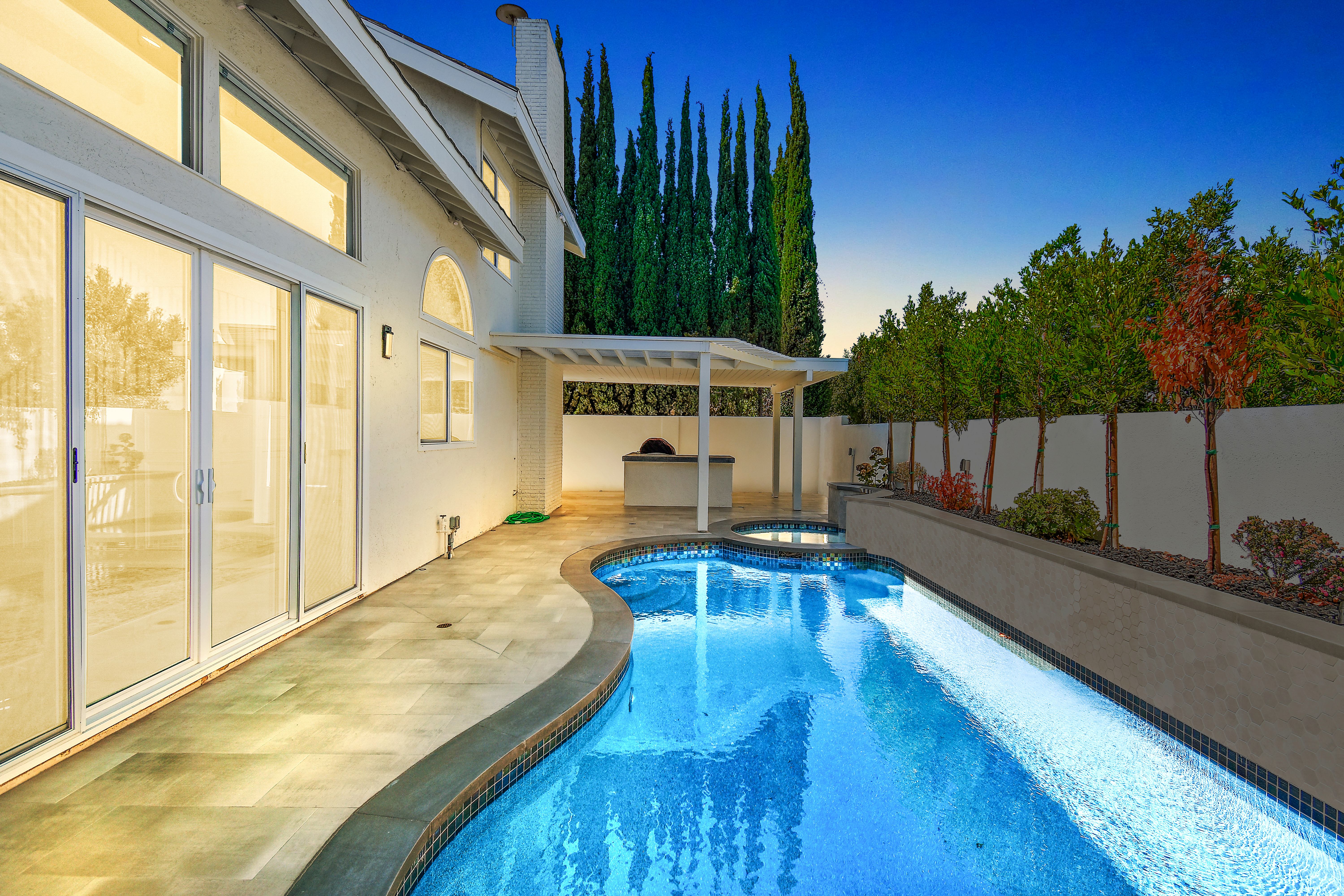 Rainstar Residence backyard pool and outdoor lounge area designed for relaxed everyday living.