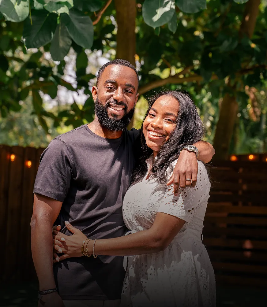 Codner and partner smiling outdoors, representing the personal journey behind entrepreneurship and business ownership.