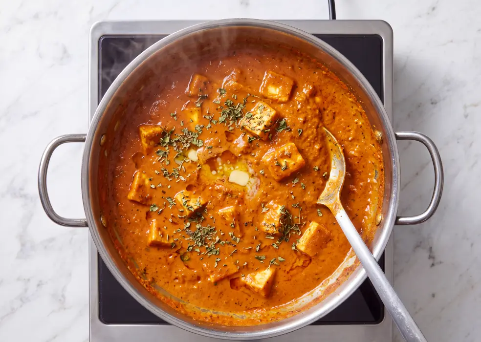 tomato-cashew puree, cream, paneer, kasuri methi, sugar, and salt