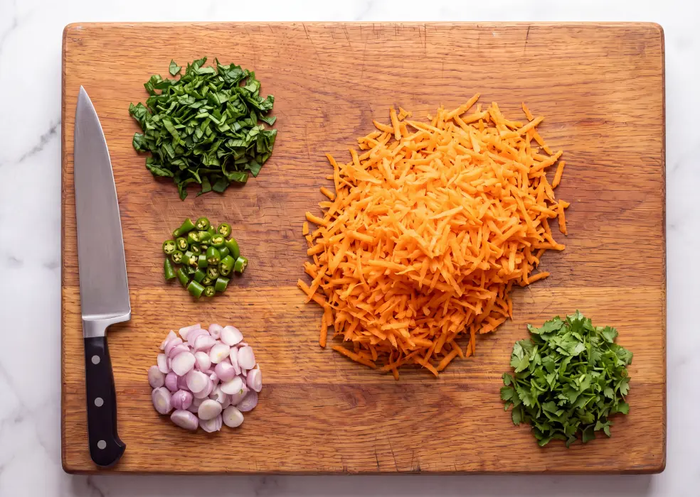 carrots, spinach, green chillies, pearl onions, and coriander leaves