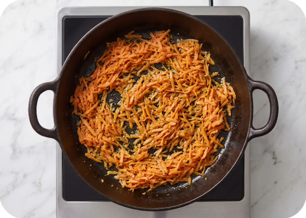  grated carrots in a pan