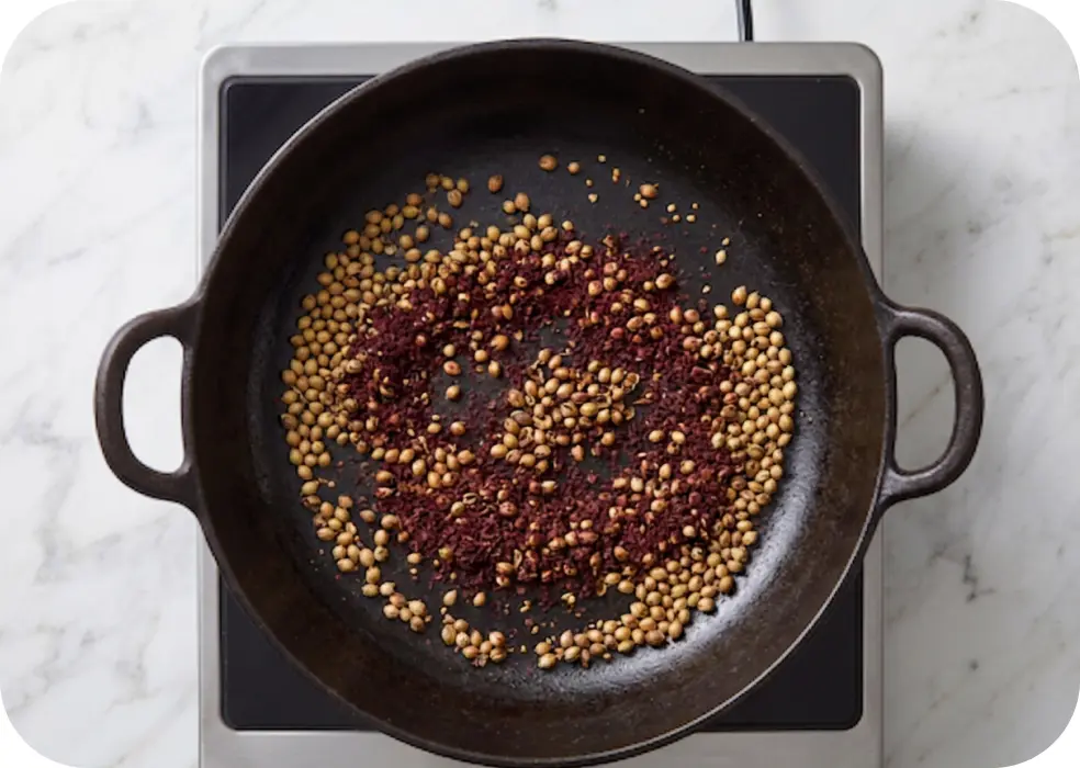 dry-roast the coriander seeds and anardana