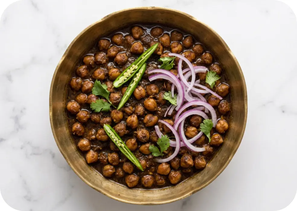 Serve the Rawalpindi Chole with onion & green chilli
