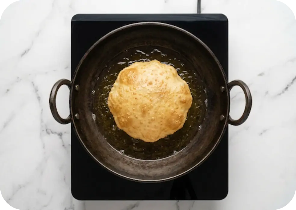 the oil and fry, turning once, until puffed, cooked through, and lightly browned