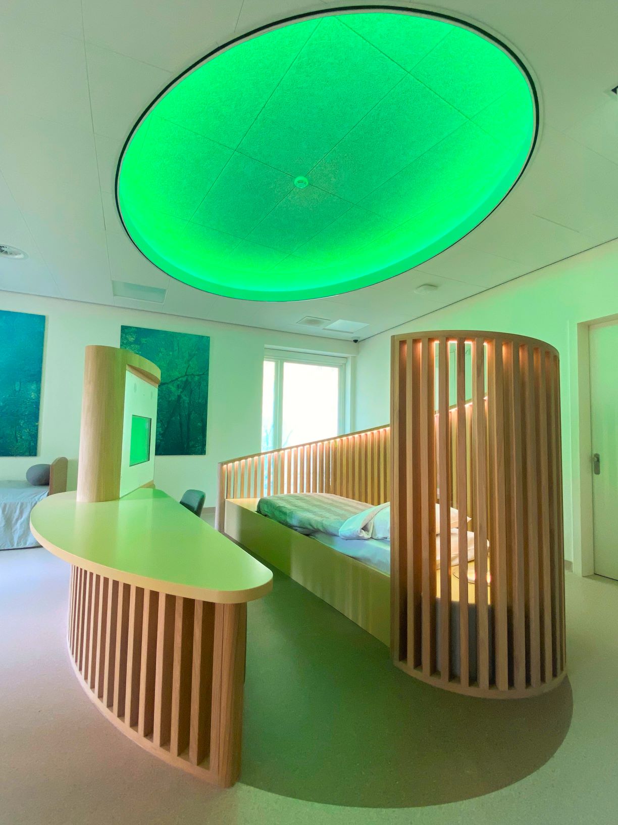 iSmart human-centered identification and safety solution digital kiosk displayed in a modern, wood-paneled office environment with a professional walking by.