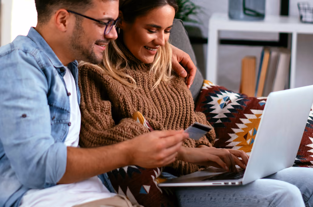 Man and woman using a laptop