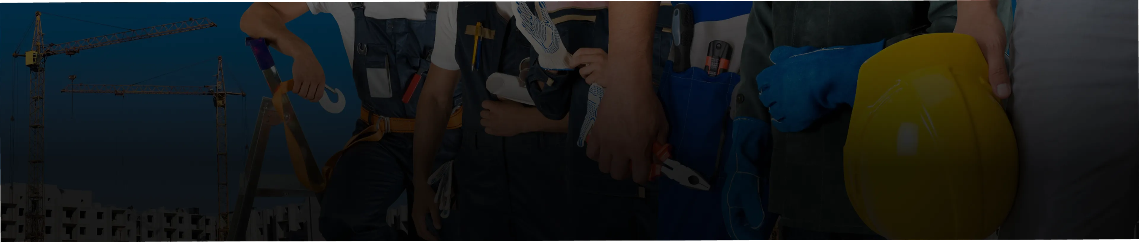 Construction workers in uniforms holding tools and a yellow safety helmet.