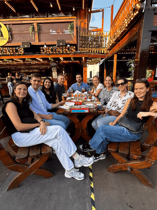The Yields team sitting on a terrace.
