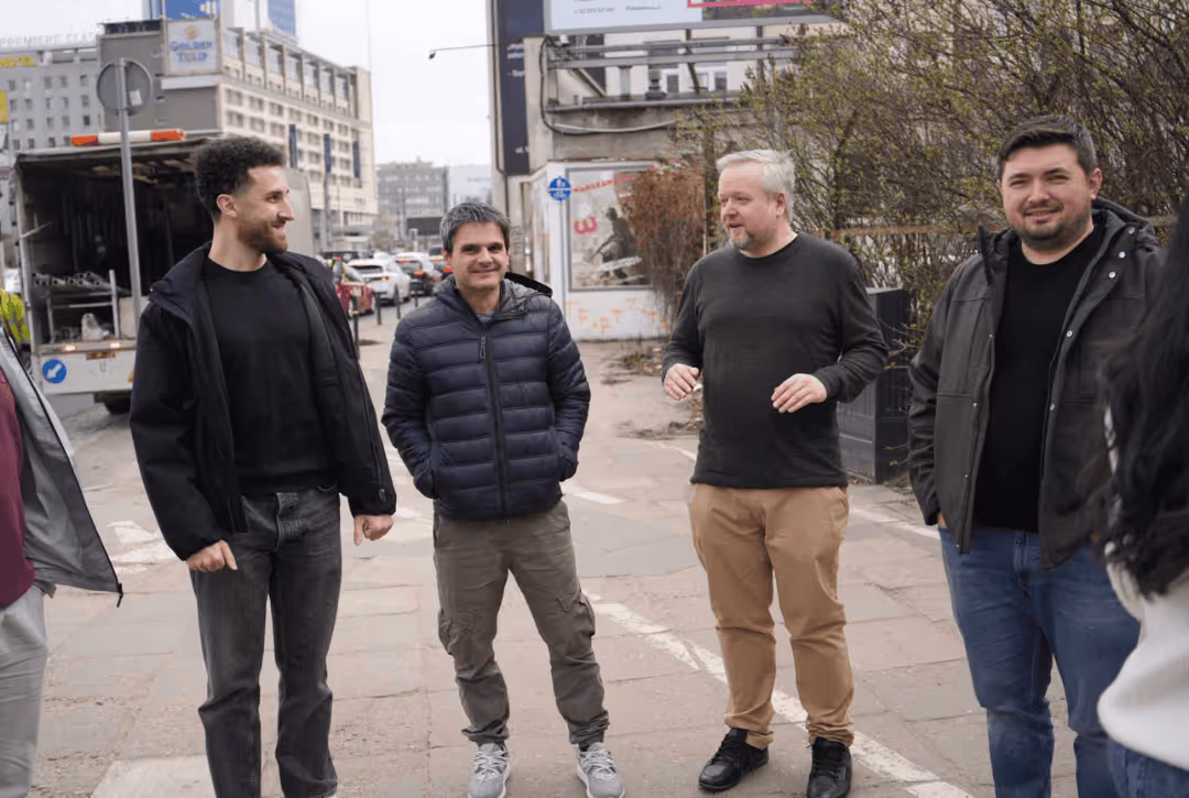 The Yields team catching up during their time in Warsaw.