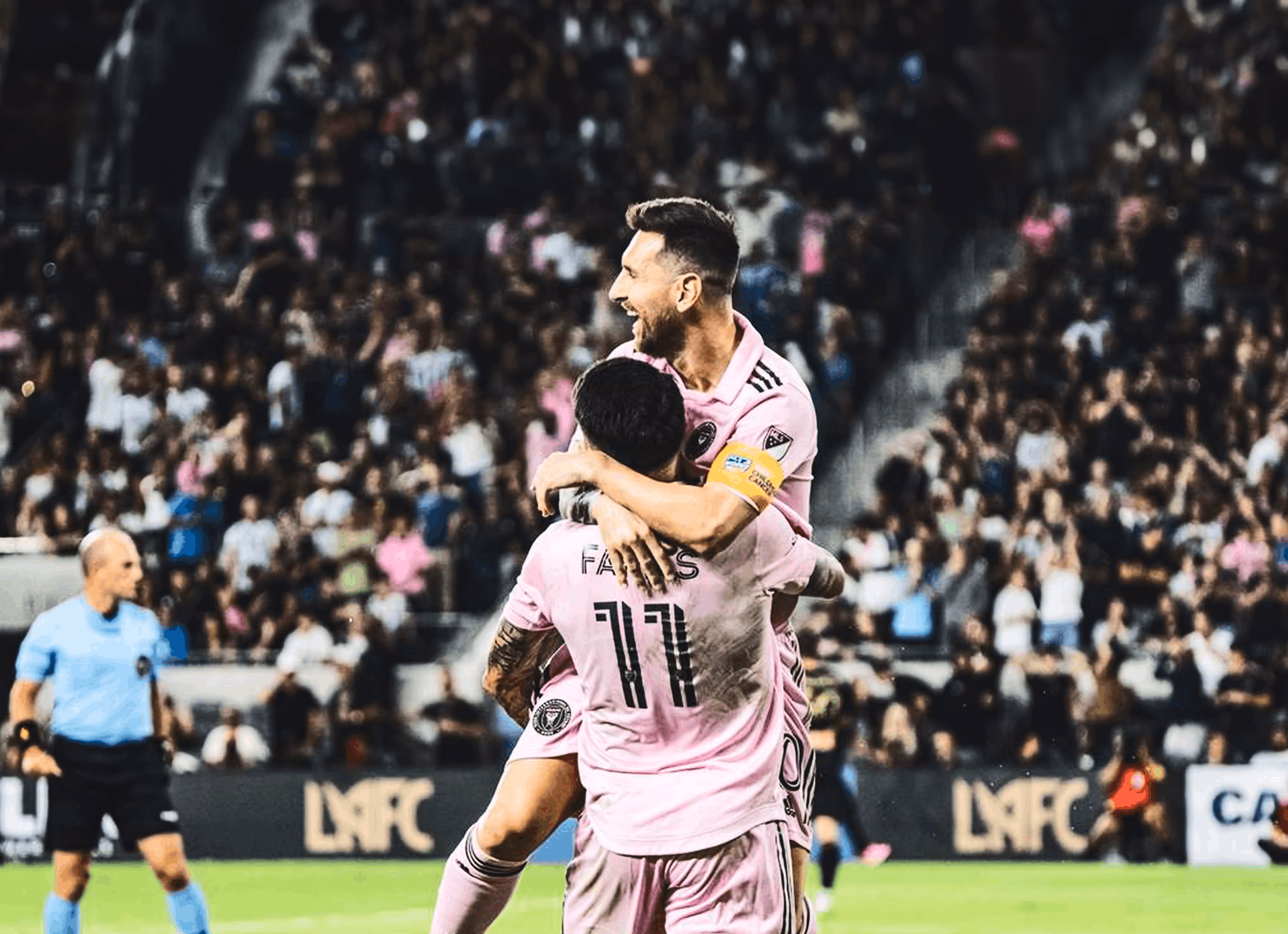 Messi huggin player on the ground