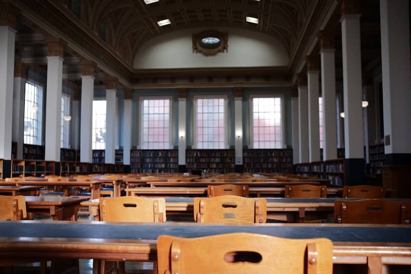 Inside of a library with empty tables.