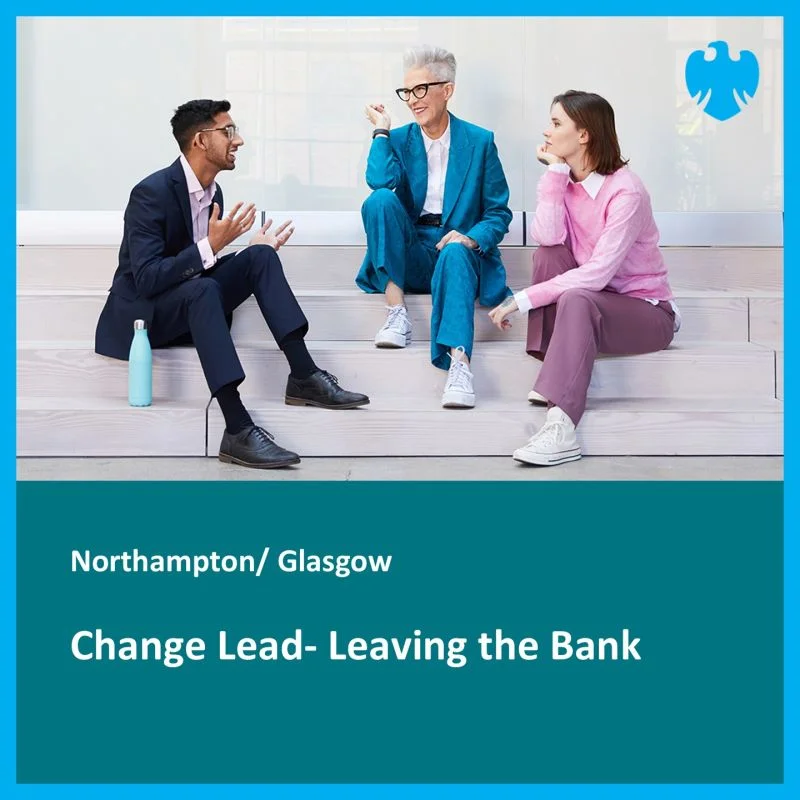 Three professionals having a discussion while sitting on steps in a modern office building, representing workplace transitions and knowledge transfer.