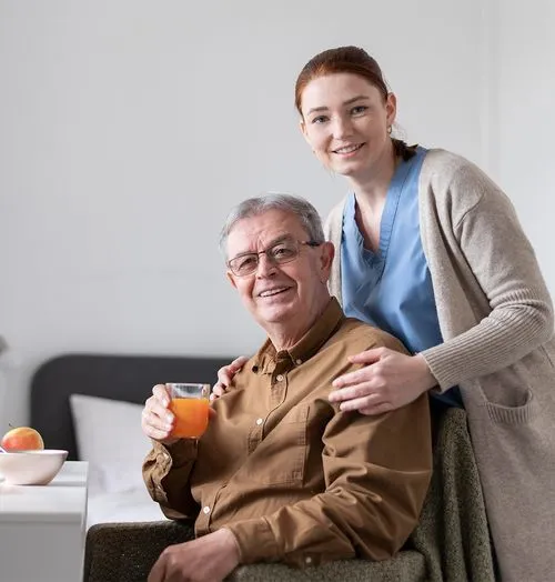 Carer and patient drinking orange juice