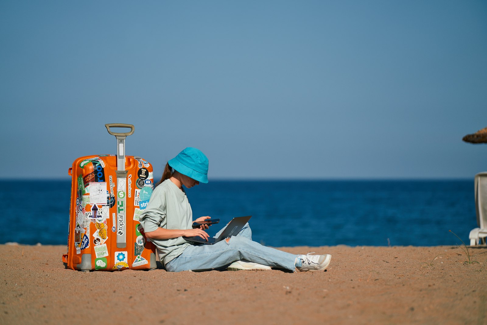 Beach travel with suitcase — pre-summer Botox timing in Frisco TX at Bellissima BB Med Spa