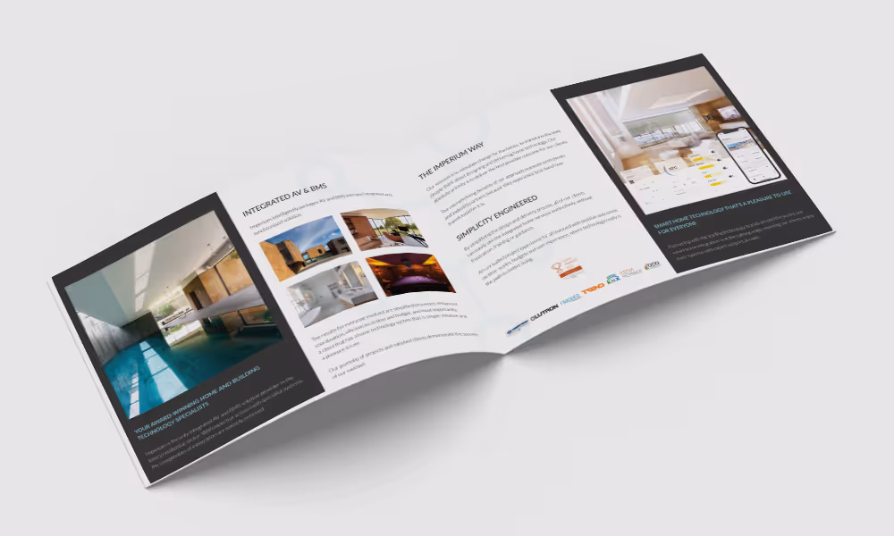 Open tri-fold brochure displaying luxury home technology solutions with images of modern interiors and smart home devices.