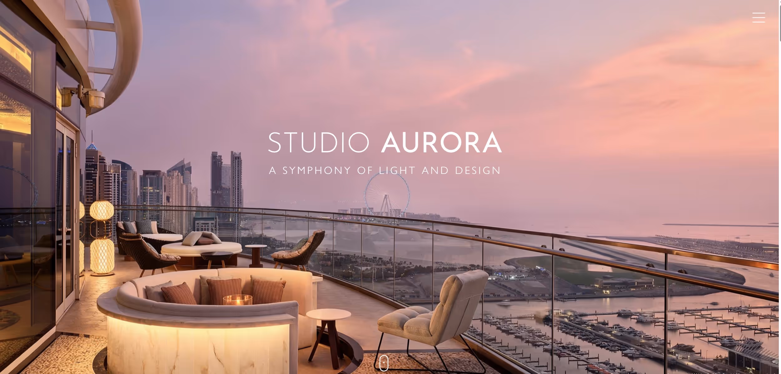 Modern outdoor balcony lounge with cushioned seating overlooking a marina and city skyline at sunset.