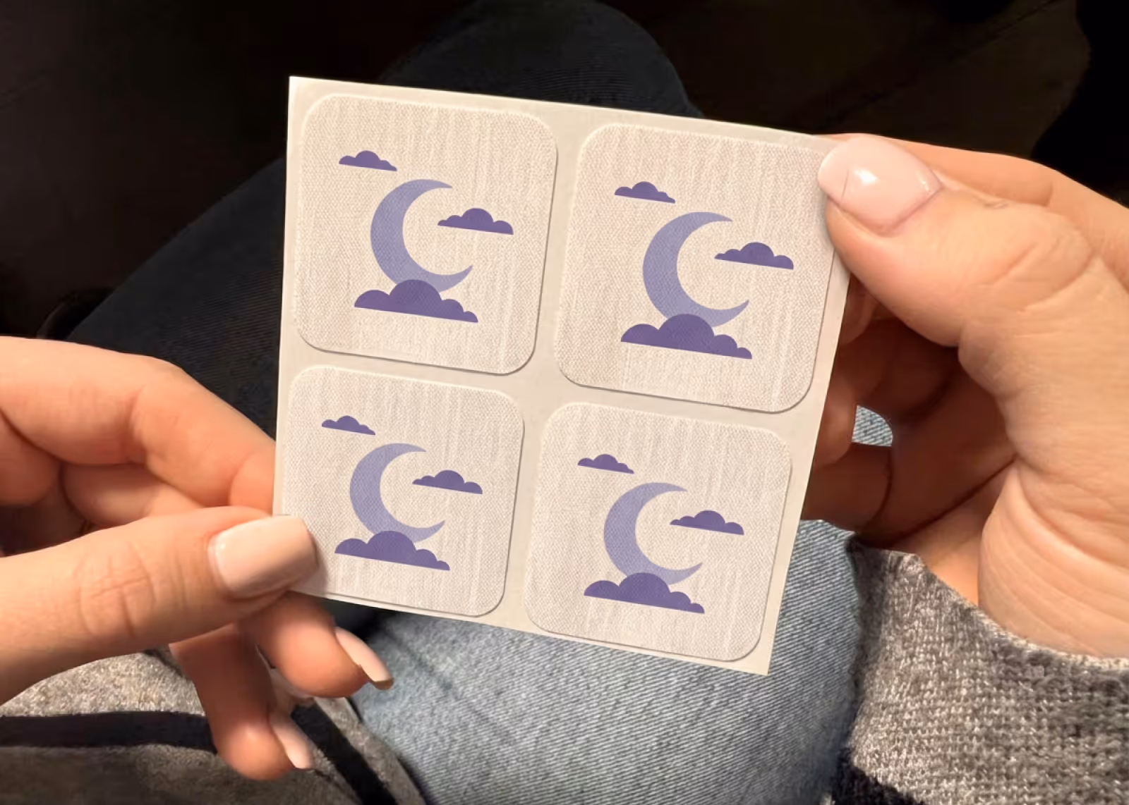 Woman applying sleep patch before bed