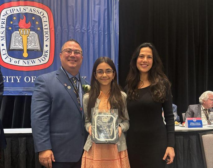 Student receiving award at NYC MS Principals Association ceremony